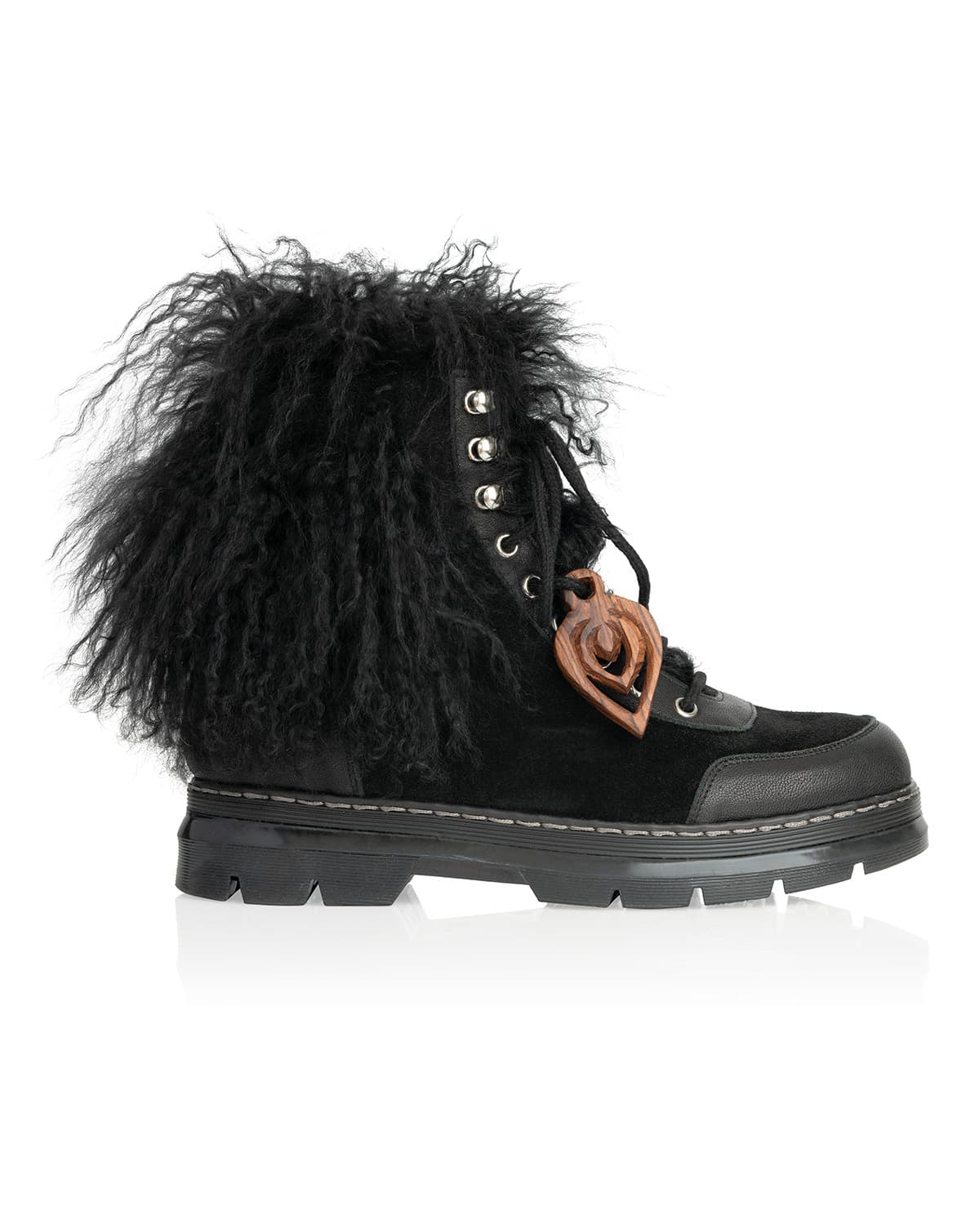 Shearling combat boot with wooden charm — mixed textures: fur, suede, leather, wood