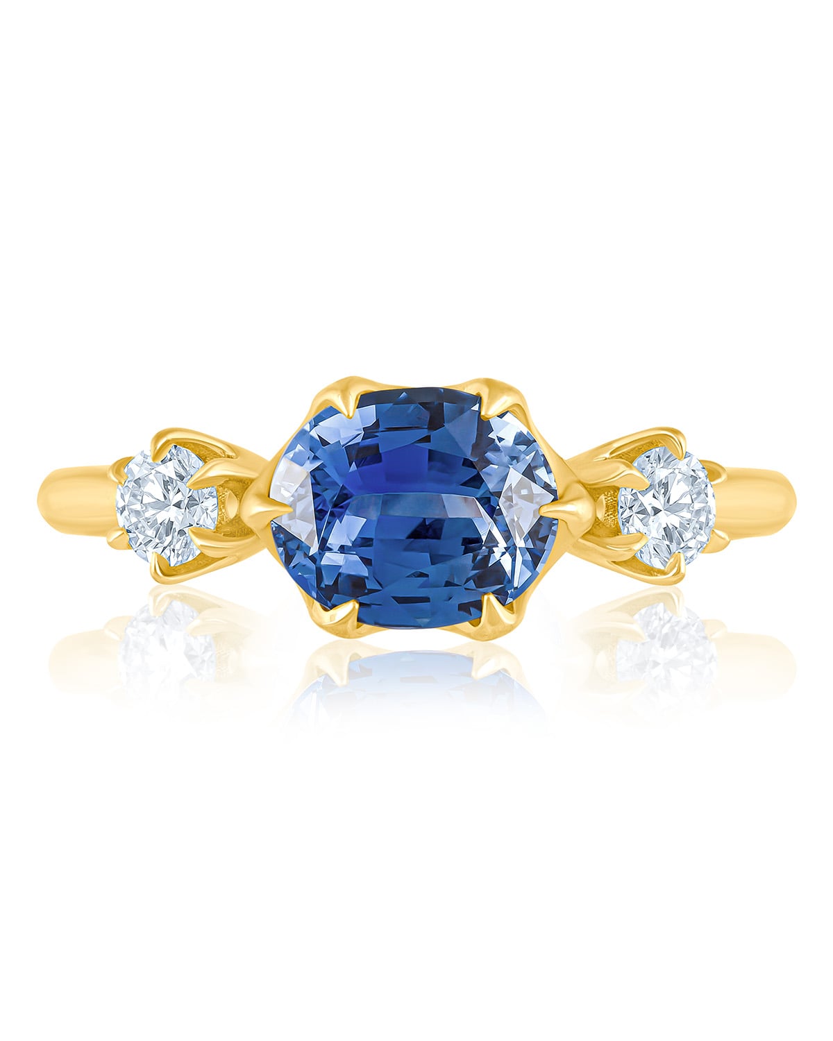 Blue sapphire ring with diamond accents — true gem color under controlled lighting