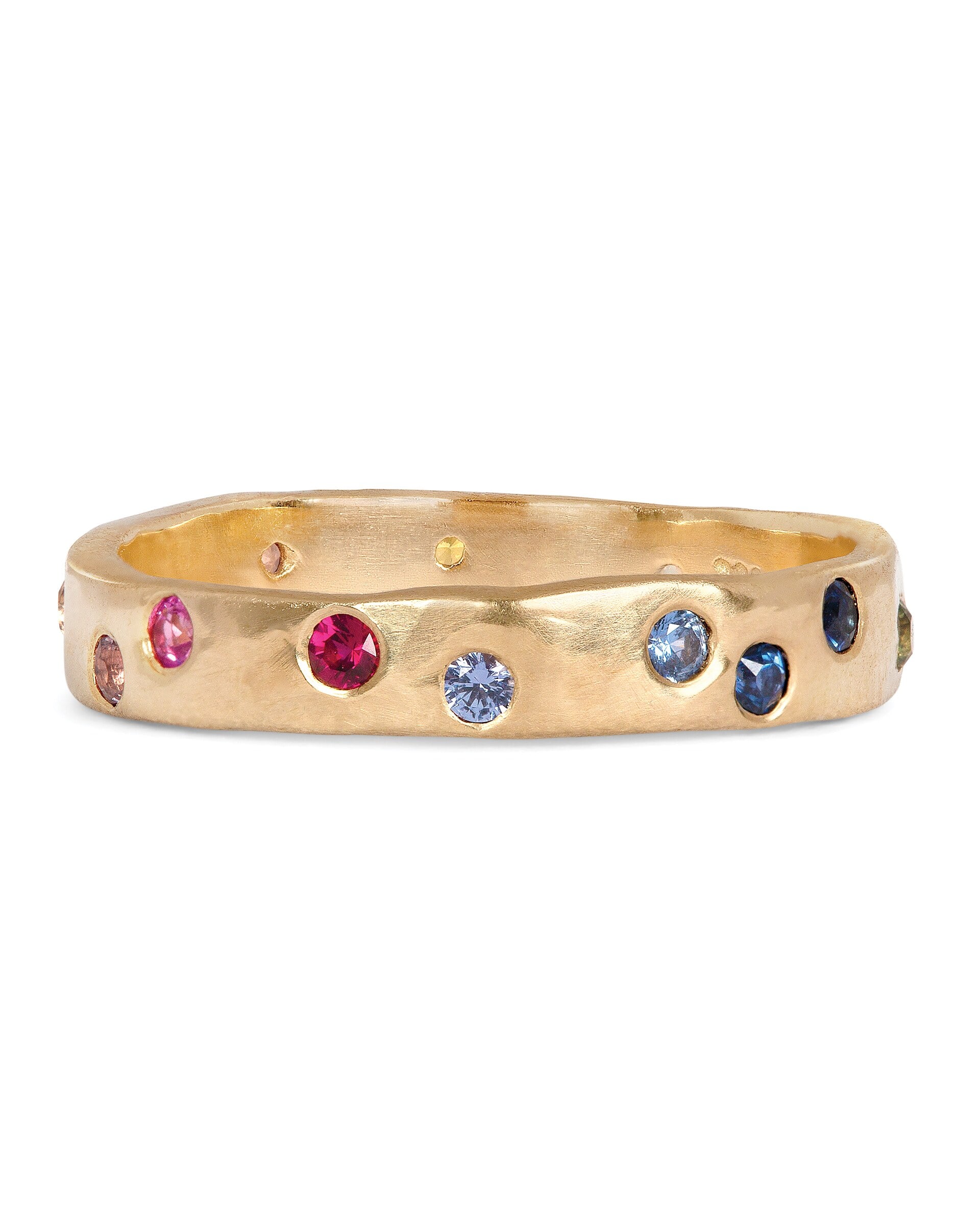 Gold band with multi-colored gemstones. Precise facet clarity on each stone
