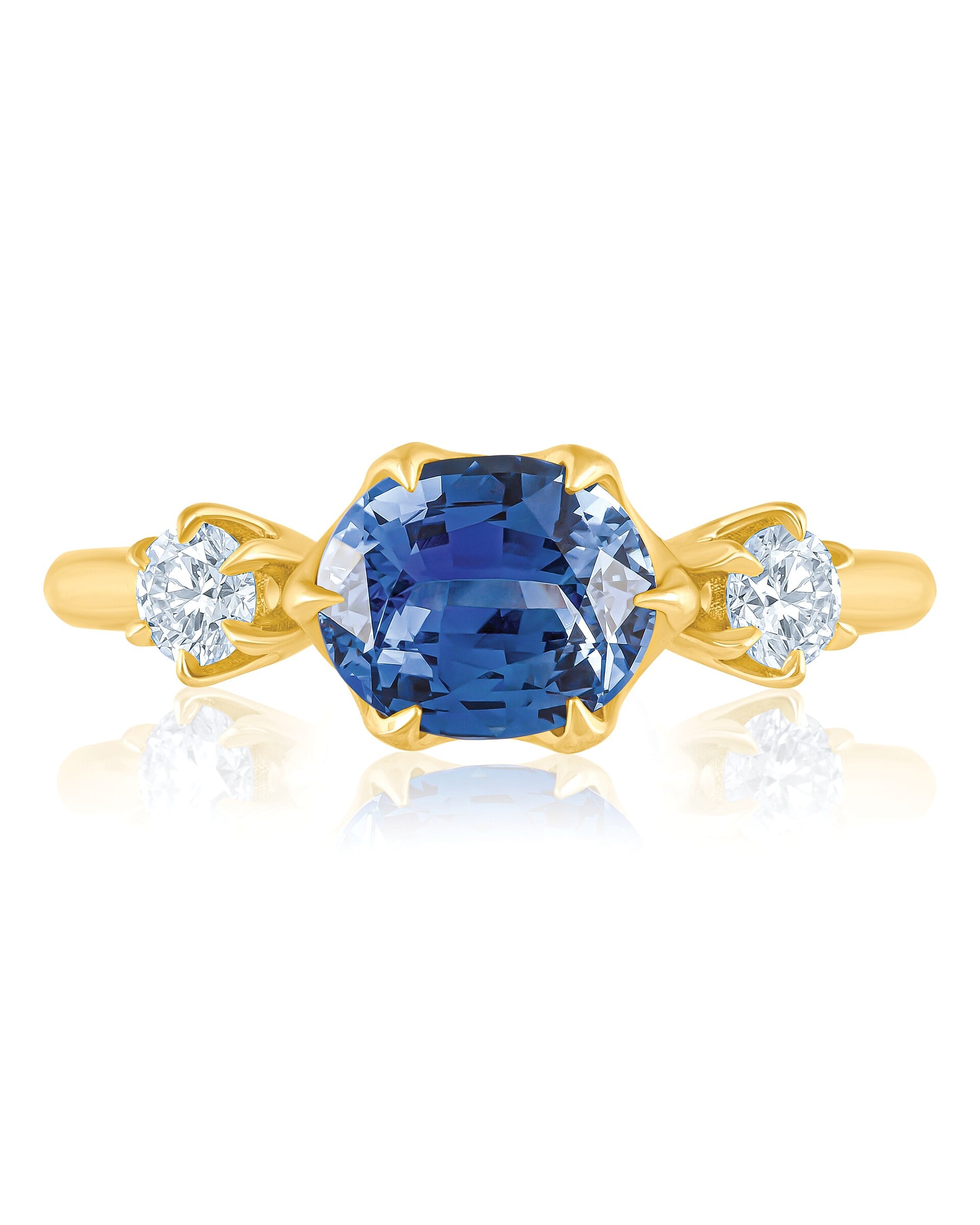 Blue sapphire ring with diamond accents. True gem color under controlled lighting